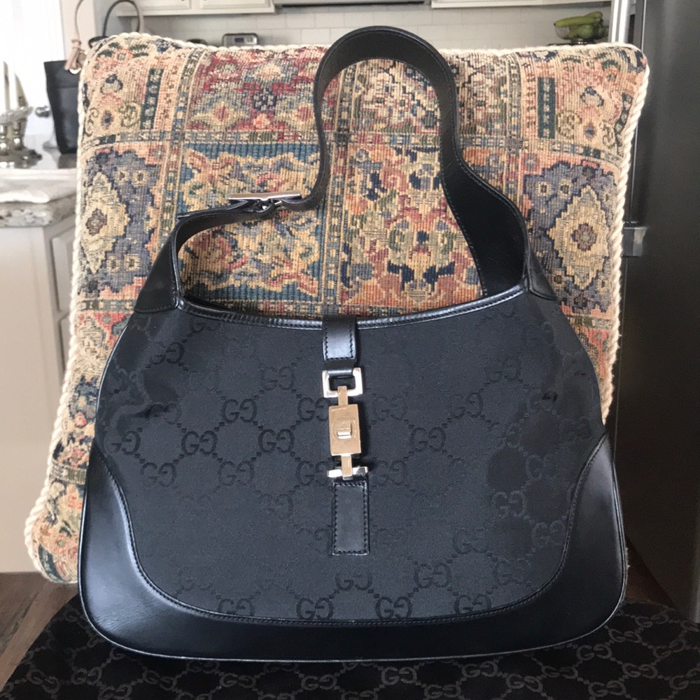Authentic Gucci bag with leather trim.